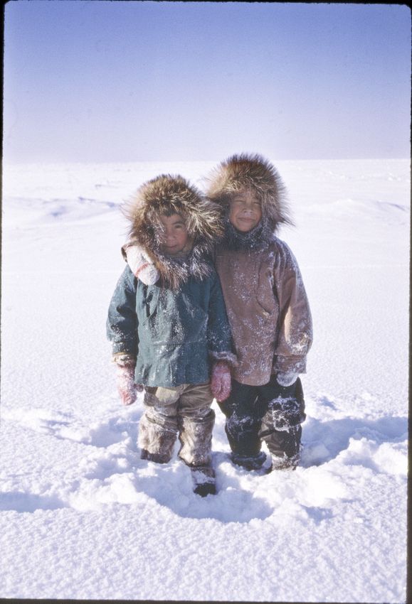 Stanley Tocktoo (right) and Alfred Weyiouanna, now a ranger working with National Park Service at Kotzebue. They are enjoying what they do best, playing in the sub-zero weather in fresh snow.